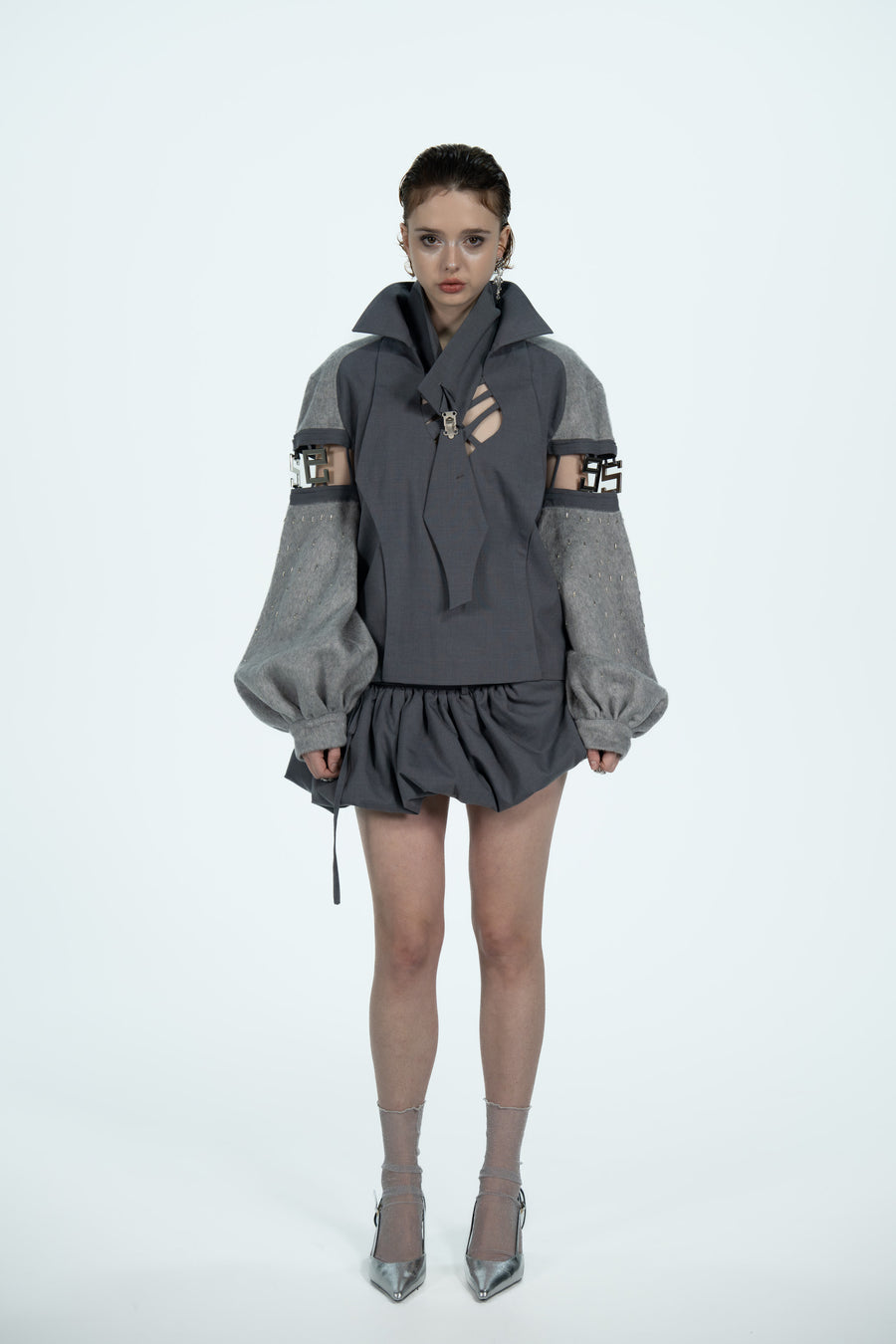 Hollowed-out wool top with a puffy skirt